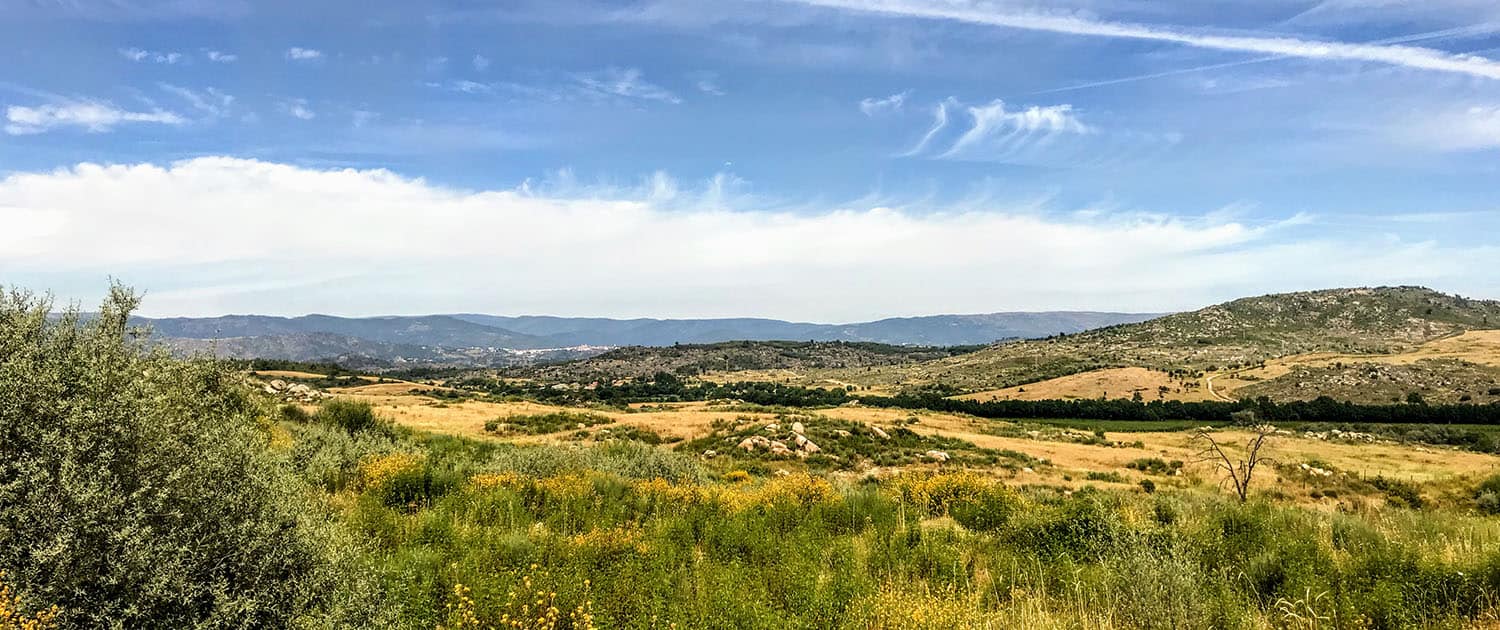 Vast Portuguese countryside with rolling hills and lush greenery, perfect for nature trails and outdoor exploration.